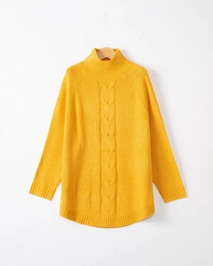 Detail of yellow cable knit pattern and ribbed neckline on turtleneck sweater