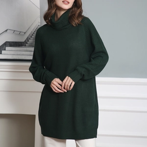 Detail of dark green knit sweater featuring high-neck collar and ribbed knit texture