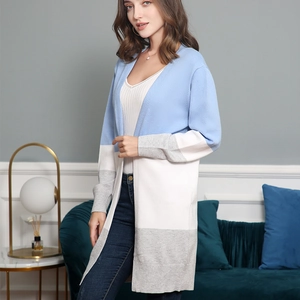 Detail shot of long-sleeved color-block knit cardigan in blue, white and grey tones