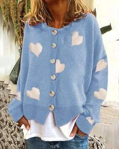Light blue knit cardigan for women with white heart patterns and button closure