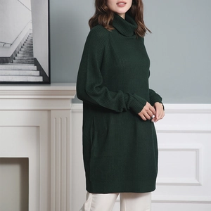 Detail of dark green knit texture and high collar on a loose oversized sweater dress