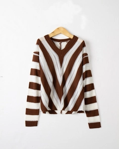 Detailed knit texture and brown-white striped V-neck pattern on long sleeve sweater