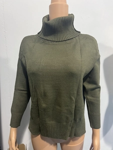 Close-up of olive green knit sweater featuring a ribbed high turtleneck and soft texture