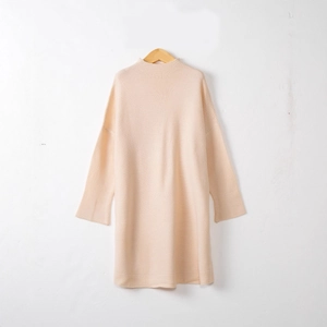Women's pink long sleeve turtleneck knitted sweater dress in a loose fit minimalist style