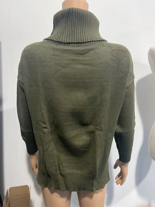 Back view of dark green turtleneck knit sweater with drop shoulder and ribbed cuffs