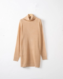 Detailed close-up of ribbed knit texture on a high-neck long-sleeve winter sweater