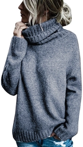 Close-up of chunky grey turtleneck knit sweater featuring loose fit and rib-knit cuffs