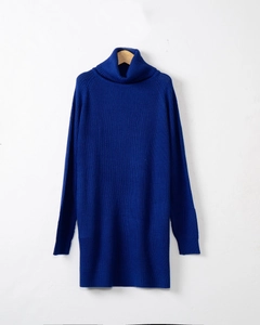 Detailed texture of royal blue high-neck knitted long sweater with ribbed cuffs and hem
