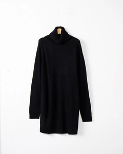 Detailed texture of high collar and thick knit fabric on black long sleeve sweater dress