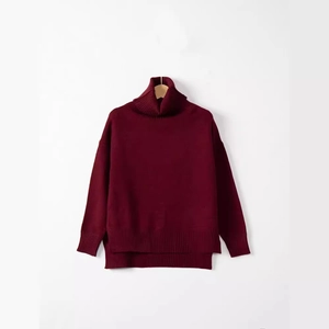 Cozy oversized burgundy turtleneck sweater with long sleeves and ribbed knit details
