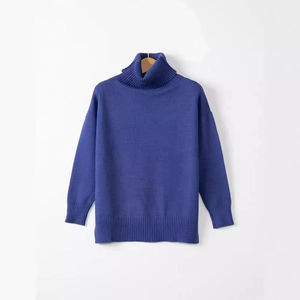 Women's royal blue turtleneck knit sweater with loose fit and ribbed cuffs in classic style