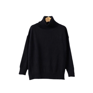 Women's black turtleneck sweater with thick knit long sleeves and a loose casual fit