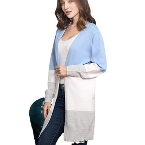 Women's color block knit cardigan featuring blue, white and grey long sleeve design
