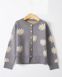 Close-up of gray knit cardigan featuring daisy embroidery and wooden button details