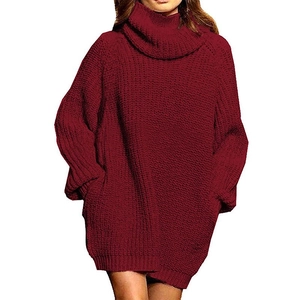Close-up of chunky burgundy knit texture on women's oversized turtleneck sweater
