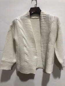 Detailed cable knit pattern on white long sleeve V-neck cardigan sweater for women