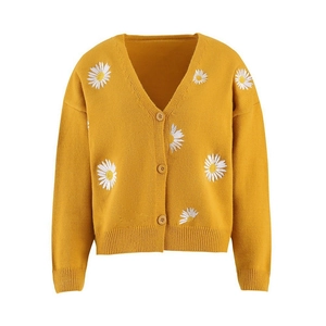 Bright yellow V-neck cardigan featuring delicate white daisy embroidery and three buttons