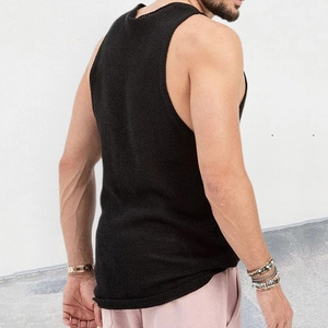 Detail of black men's knit tank top with round neck and premium ribbed fabric texture