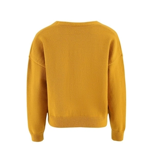 Detail of mustard yellow knit sweater with ribbed cuffs and loose drop shoulder design