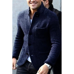 Detail of navy blue knitted cardigan with textured fabric and large front pockets for men