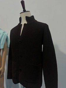 Detail of men's dark coffee waffle knit cardigan with stand collar and large buttons