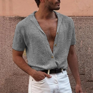 Close-up of grey short sleeve knit shirt showing breathable honeycomb texture and buttons