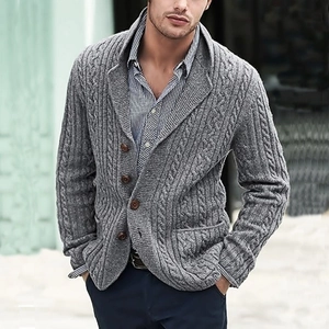 Close-up of grey cable-knit cardigan for men featuring classic brown buttons and lapel collar