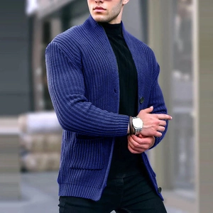 Detailed close-up of dark blue men's knit cardigan with stand collar and buttons
