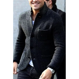 Detail of men knit cardigan with textured tweed fabric stand collar and patch pockets