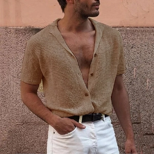 Close-up of khaki waffle knit texture and cuban collar on a casual men's short sleeve shirt
