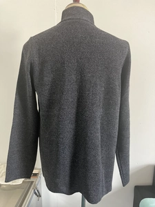 Rear view of a dark grey knit sweater for men featuring a mock neck and fine knitting detail