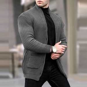 Detail of men's grey ribbed knit cardigan with large patch pockets and a shawl collar