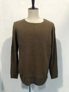 Detailed close-up of brown knit texture and crew neck design on men's long sleeve sweater