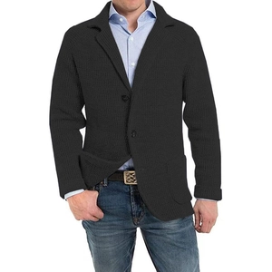Detail of men's black knit blazer showing waffle texture, classic lapels and large side pockets