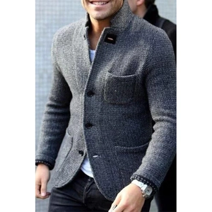 Close-up of men's slim-fit knitted blazer with standing collar and textured gray fabric