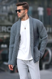 Detail of grey knitted cardigan with shawl collar and button closure on male model