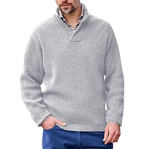Detail of light grey ribbed knit pullover showing stand collar and texture on male model
