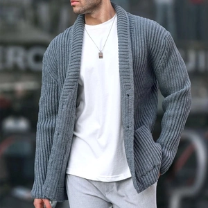 Detail of grey men's shawl collar cardigan featuring ribbed knit texture and button closure