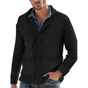 Close-up of black double-breasted knit cardigan with textured ribbing and lapel