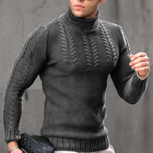 Detail view of charcoal grey high-neck sweater featuring thick cable knit patterns on chest