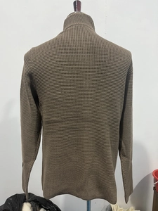 Close-up of coffee brown waffle knit sweater showing the rich texture and stand collar detail