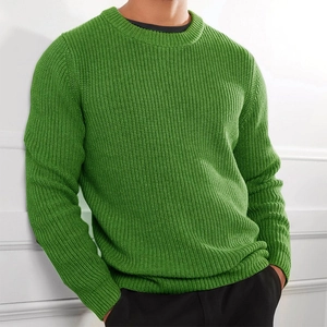 Detail of green ribbed knit sweater showing thick vertical texture and crew neck design