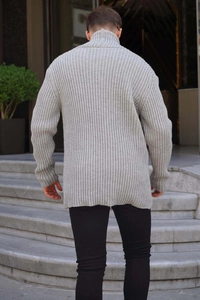 Rear view detail of men's gray knitted sweater featuring vertical ribbed texture and high neck