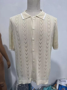 Detail of men's beige knitted polo shirt showing hollow breathable arrow pattern