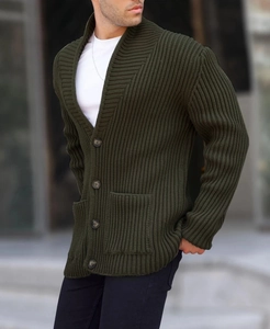 Detail of olive green knit cardigan with shawl collar and large buttons on the pockets