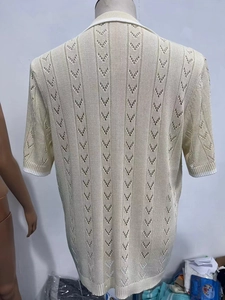 Detailed back view of beige knitted polo shirt featuring hollow V-pattern texture