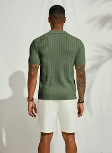 Rear view of an olive green knitted polo shirt featuring a refined vertical rib texture