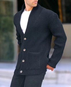Detail of charcoal ribbed cardigan showing shawl collar and dark brown button closure