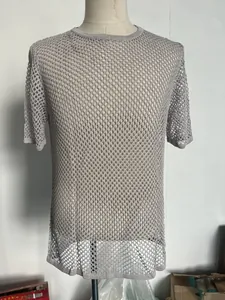 Detail view of the gray mesh knit top showing honeycomb pattern and breathable texture