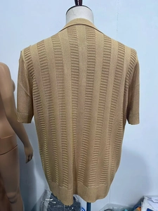 Detailed back view of a men's knit polo shirt featuring vertical textured stripes and ribbed hems